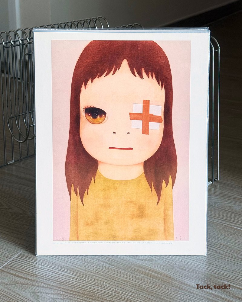 Yoshitomo Nara Eye Patch print in a clear sleeve, standing in a magazine rack, with the Tack, tack! wordmark